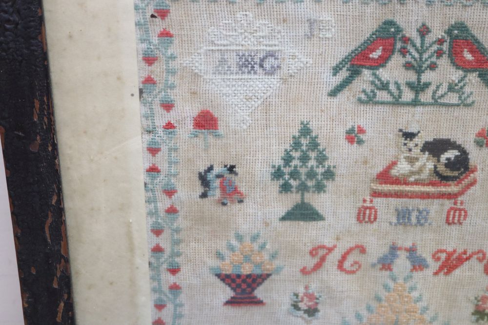 A needlework sampler dated 1886, framed as a firescreen, overall height 71cm